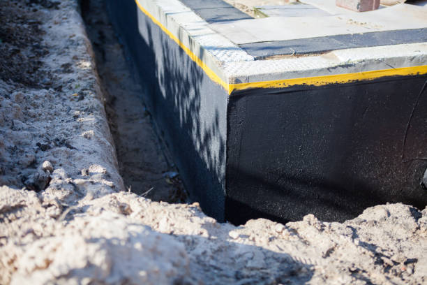 Professional Emergency Waterproofing technician working in Toledo, OH